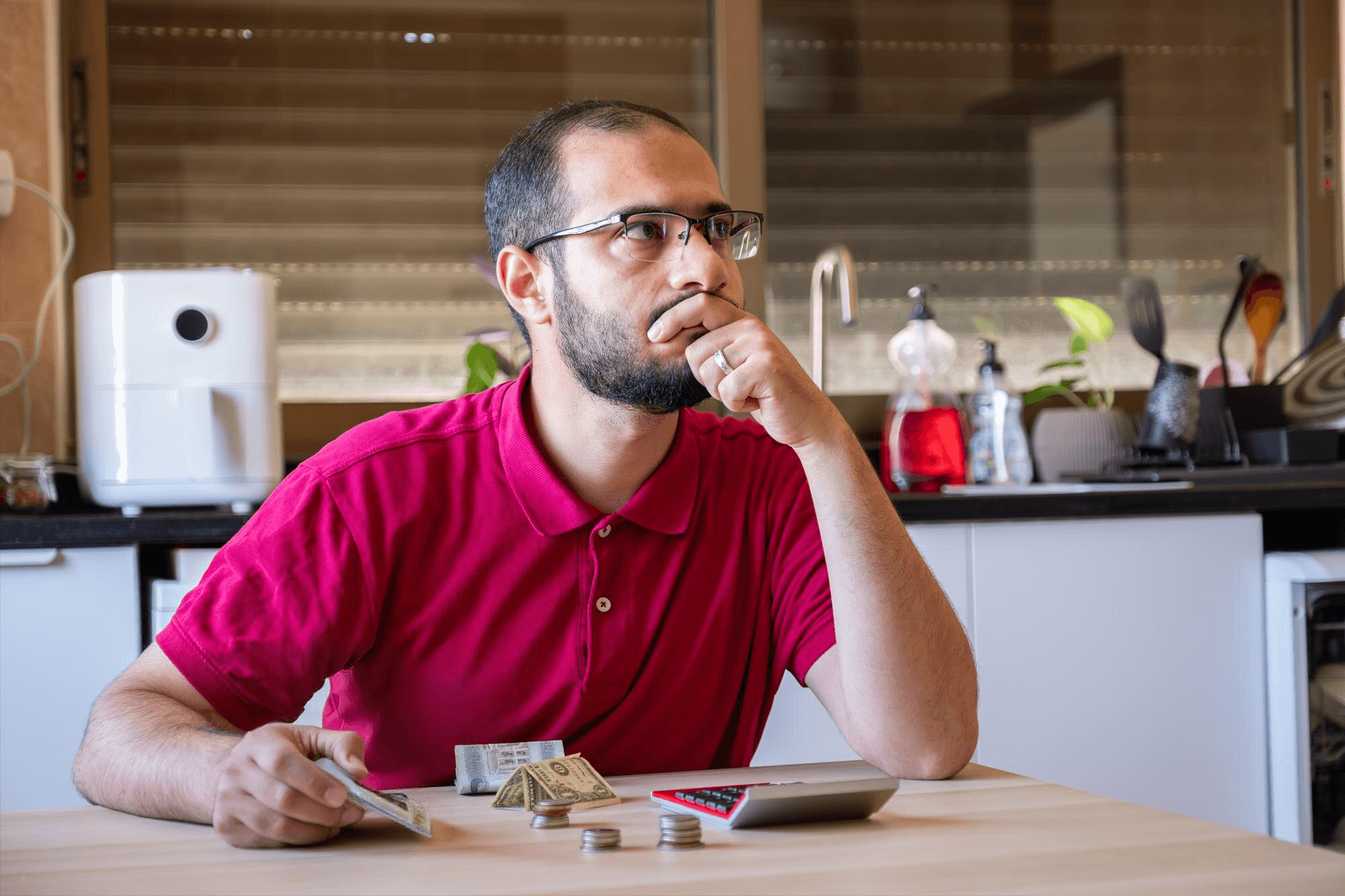 A person calculating finances to look for affordable therapists.