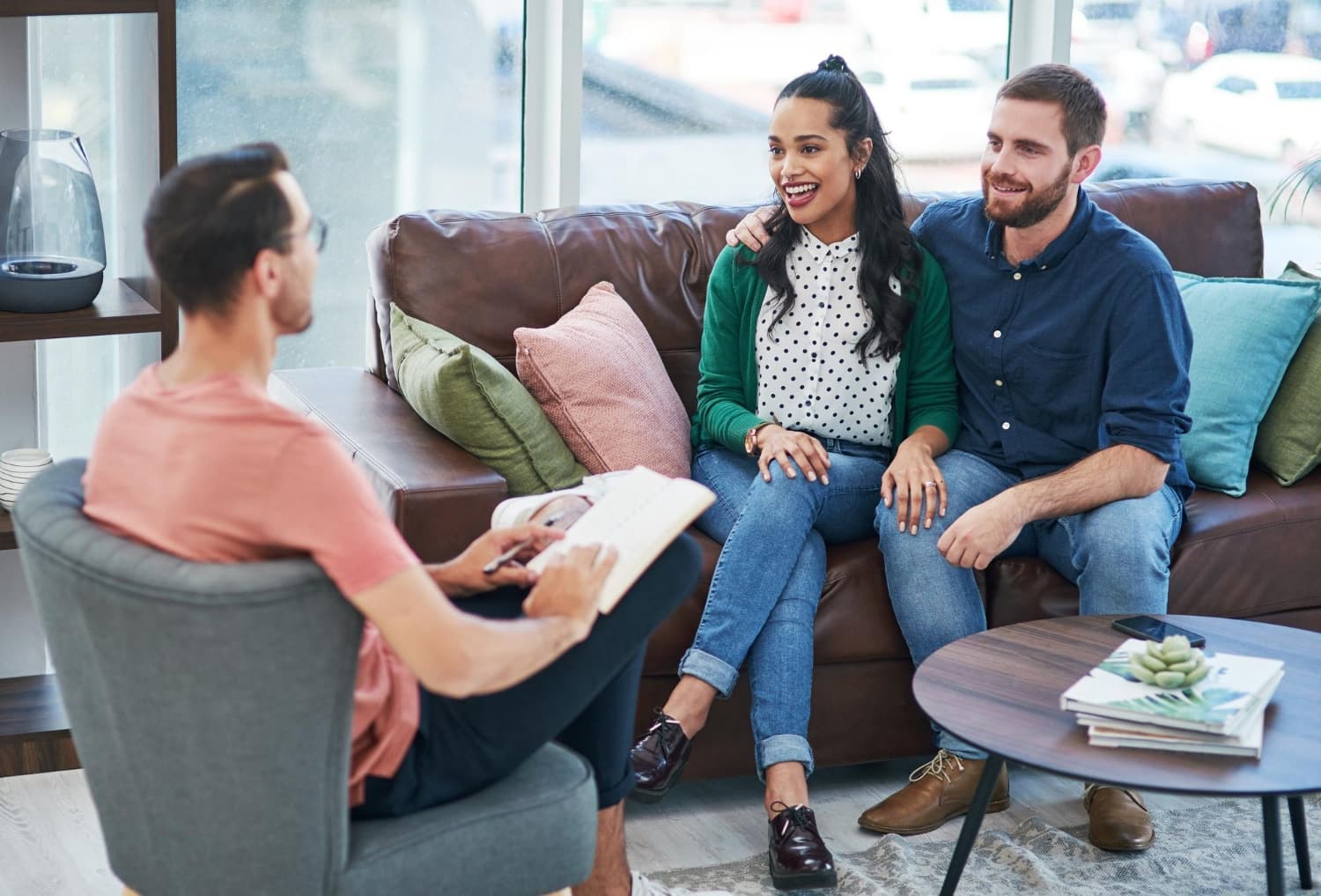 A couple talking to a counsellor during couples therapy.