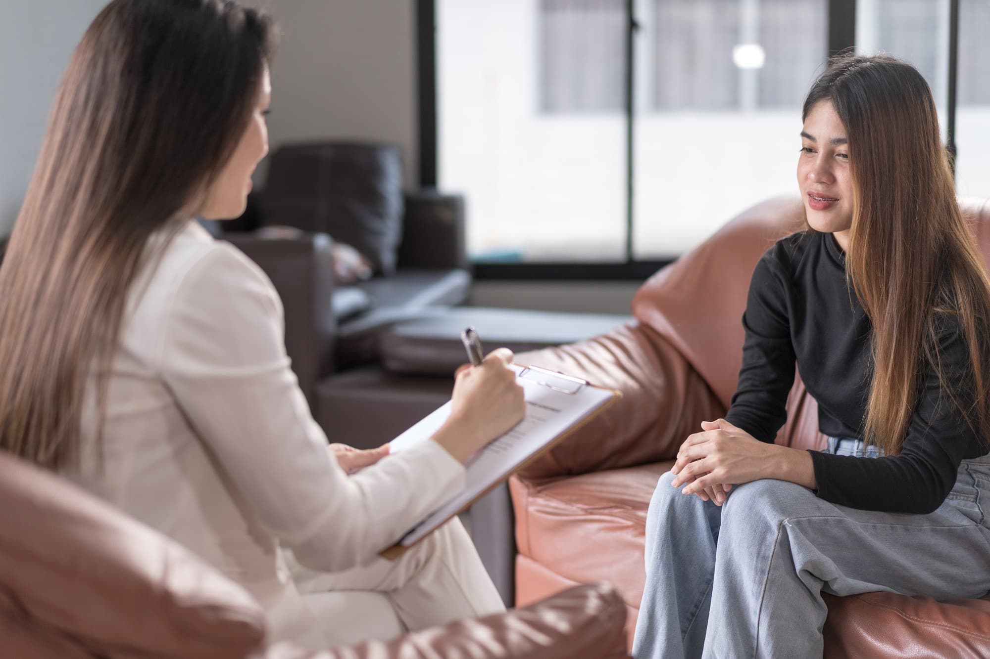 A person engaging in a counselling session with a therapist in Singapore.