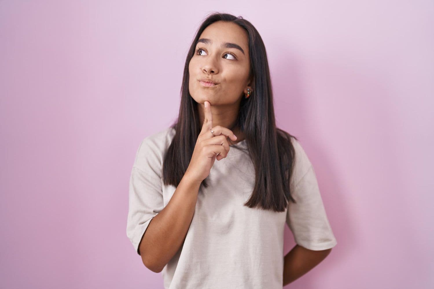 A person wondering whether reverse psychology is manipulative.