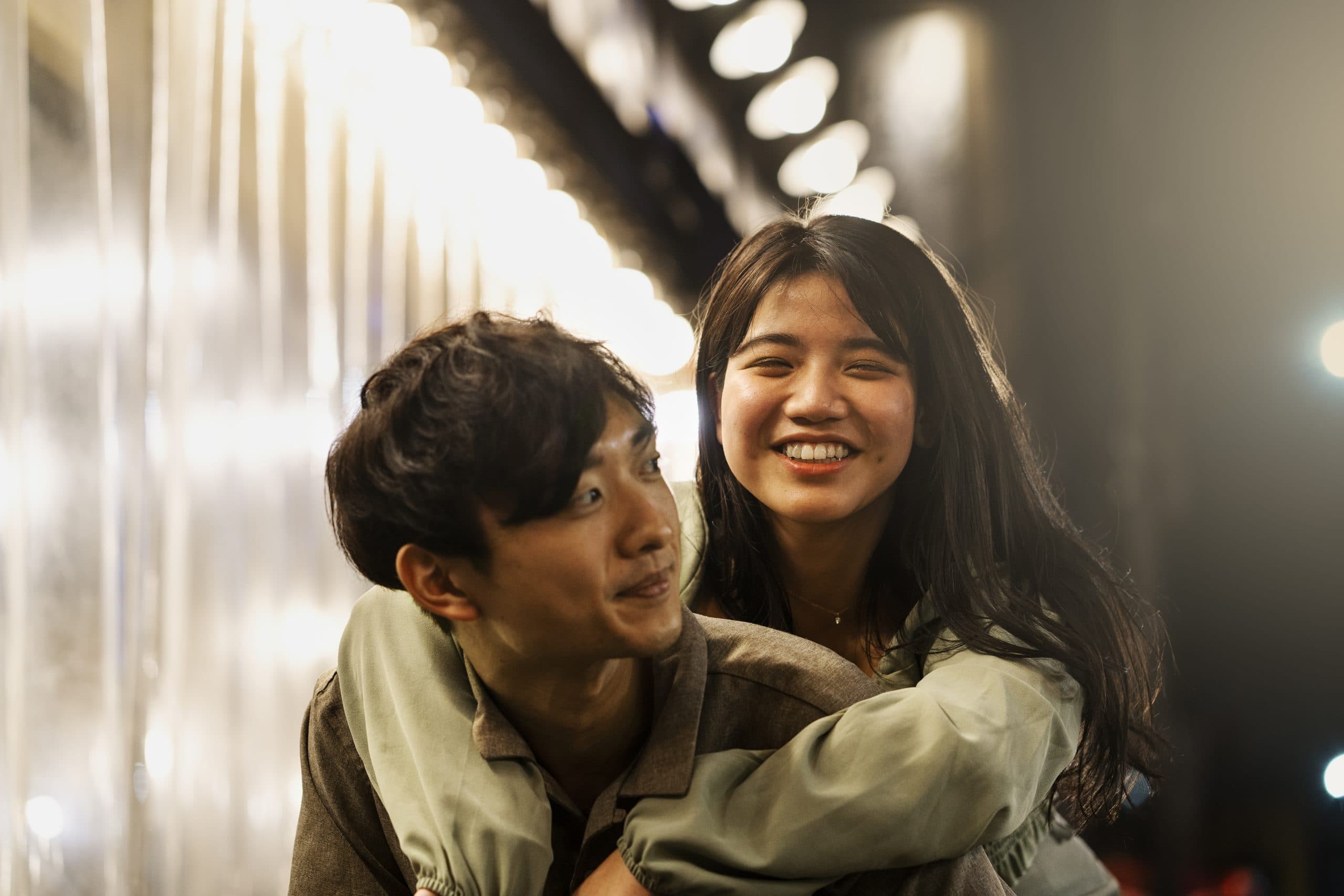 Partners looking content and happy spending time together after mental health counselling in Singapore.