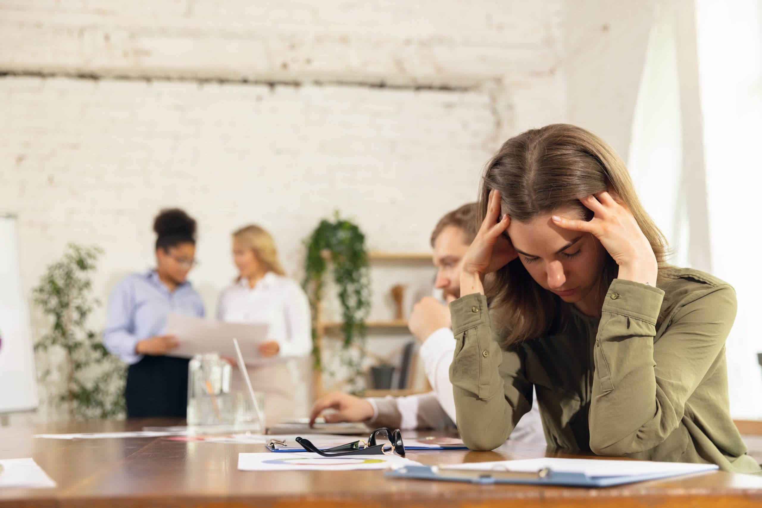 A person struggling to concentrate at work due to a common mental health issue.