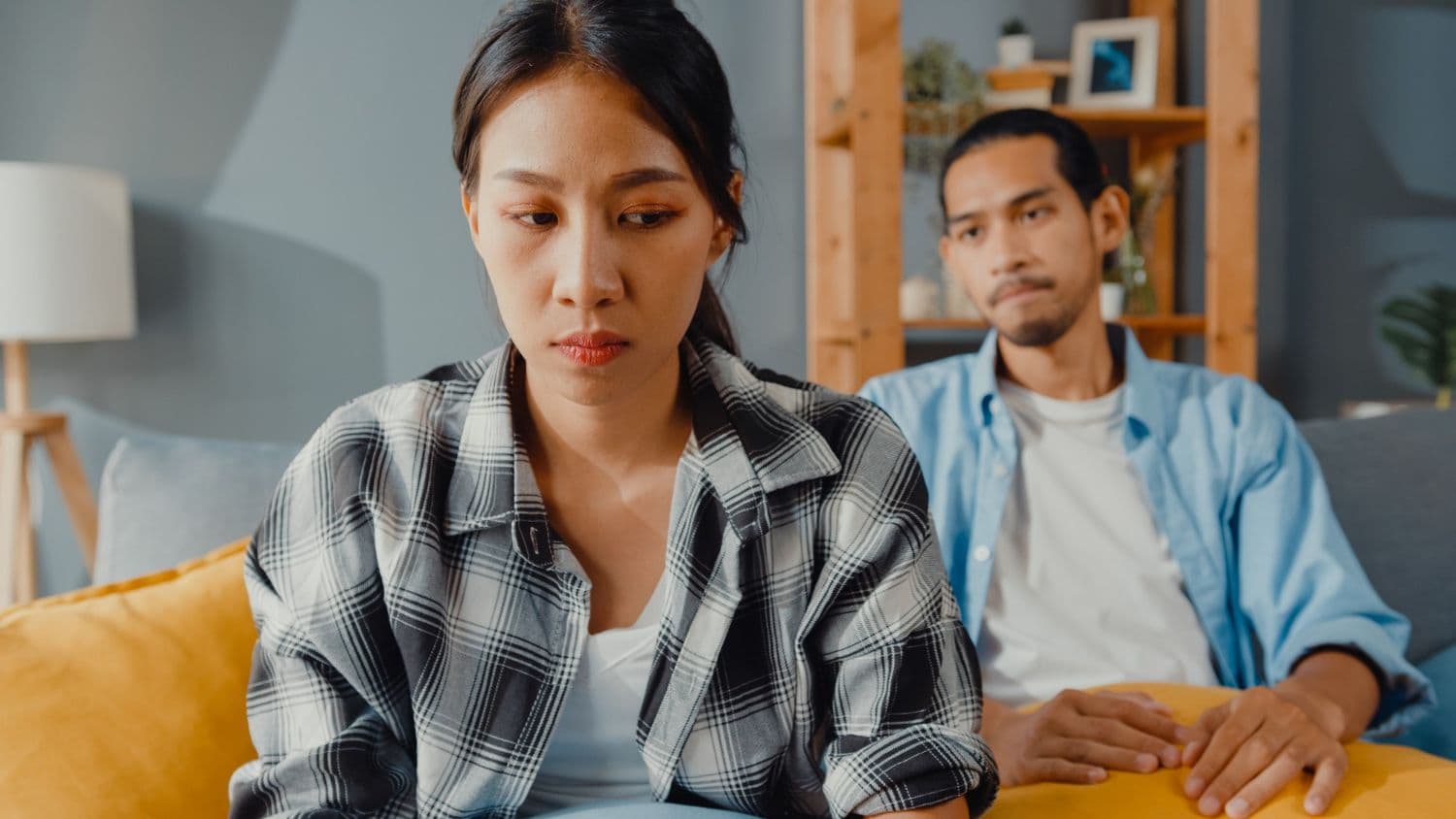 A person feeling anxious around their partner due to abandonment issues.