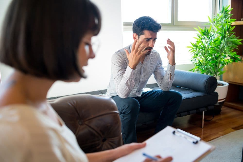 A person learning how to manage anger during a session with a Singaporean psychologist.
