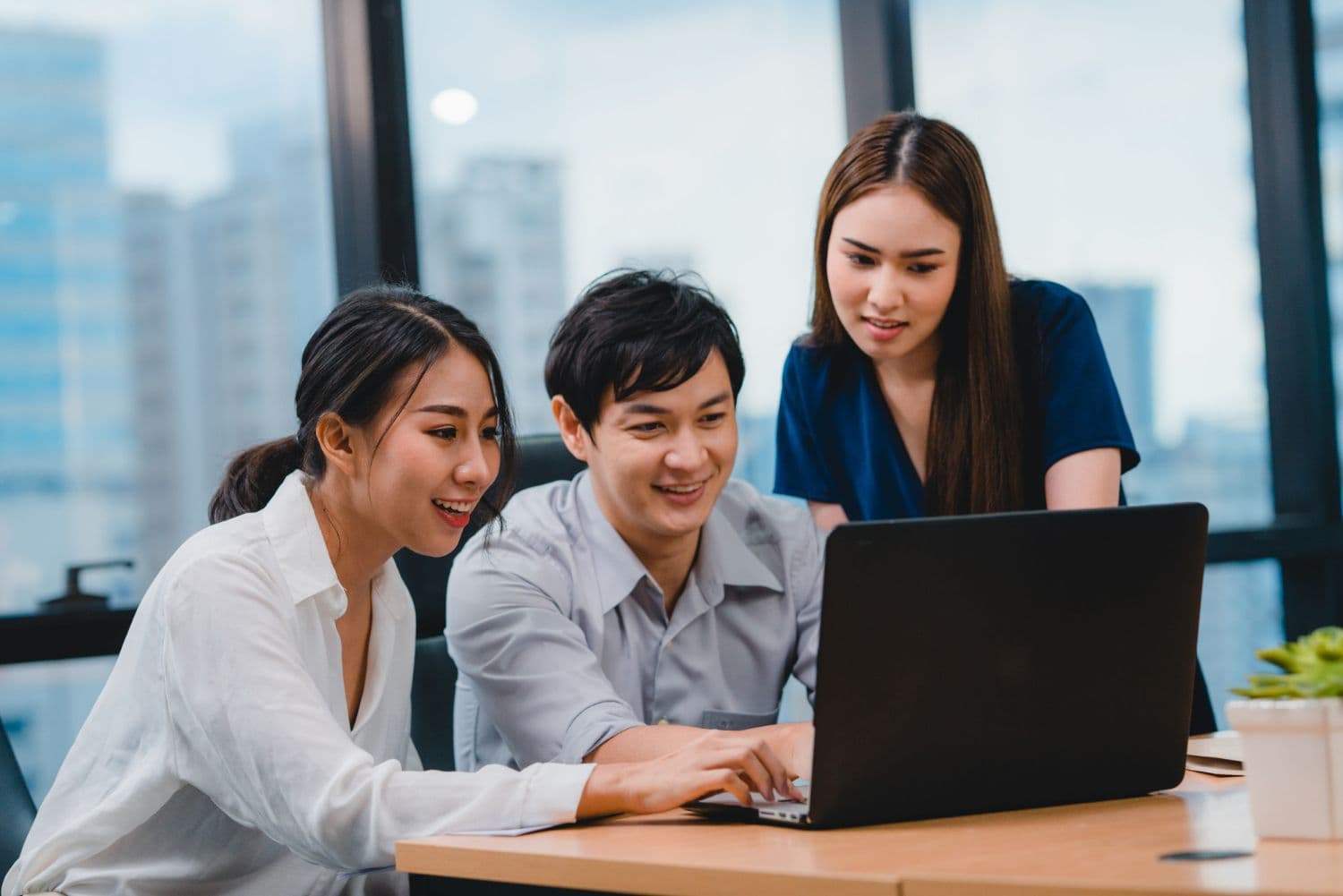 A group of working professionals engaged in a discussion. People with Type A Personality are often extremely career-driven.
