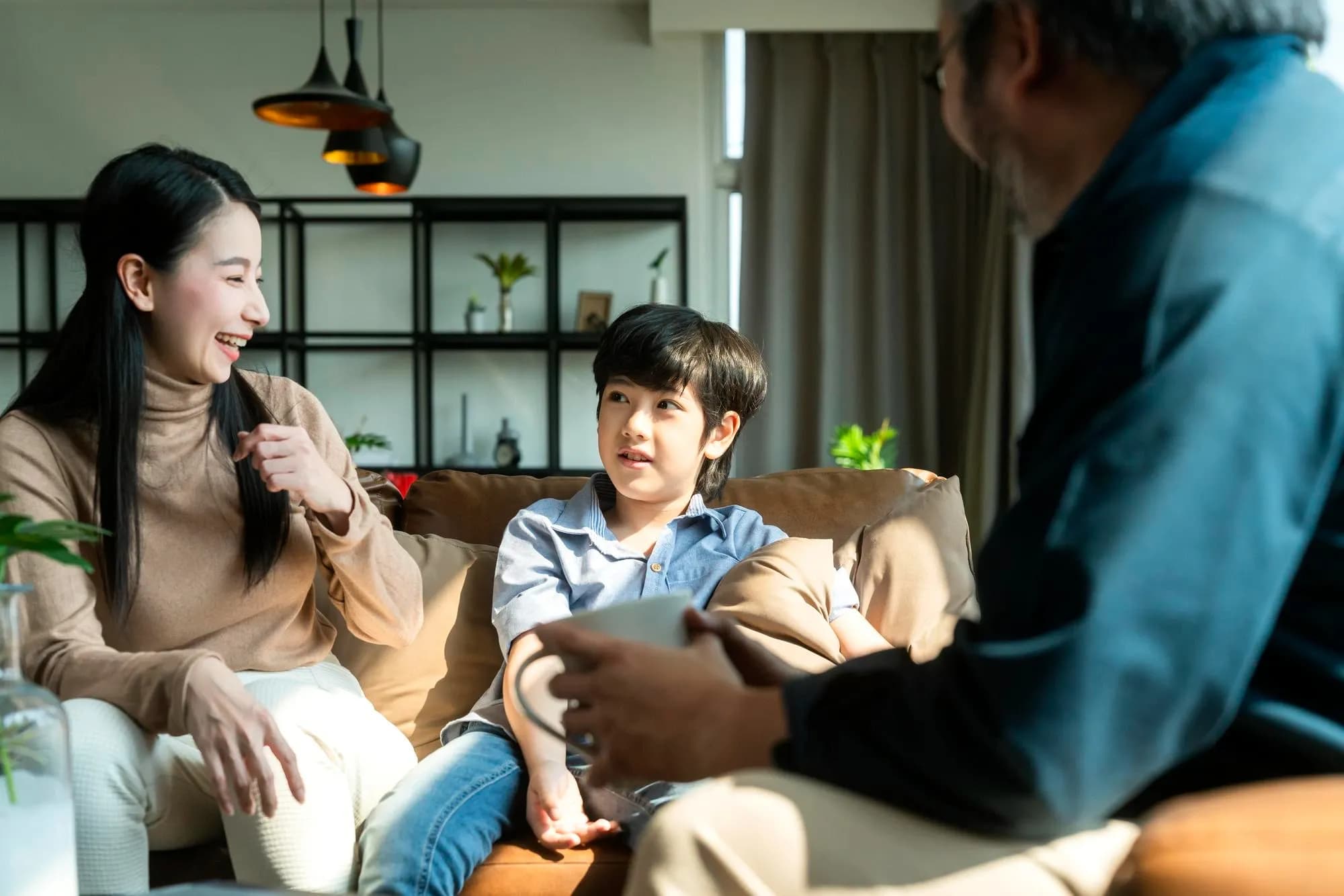 Parents having a conversation about mental health with their child, thus breaking mental health stigma in Singapore.