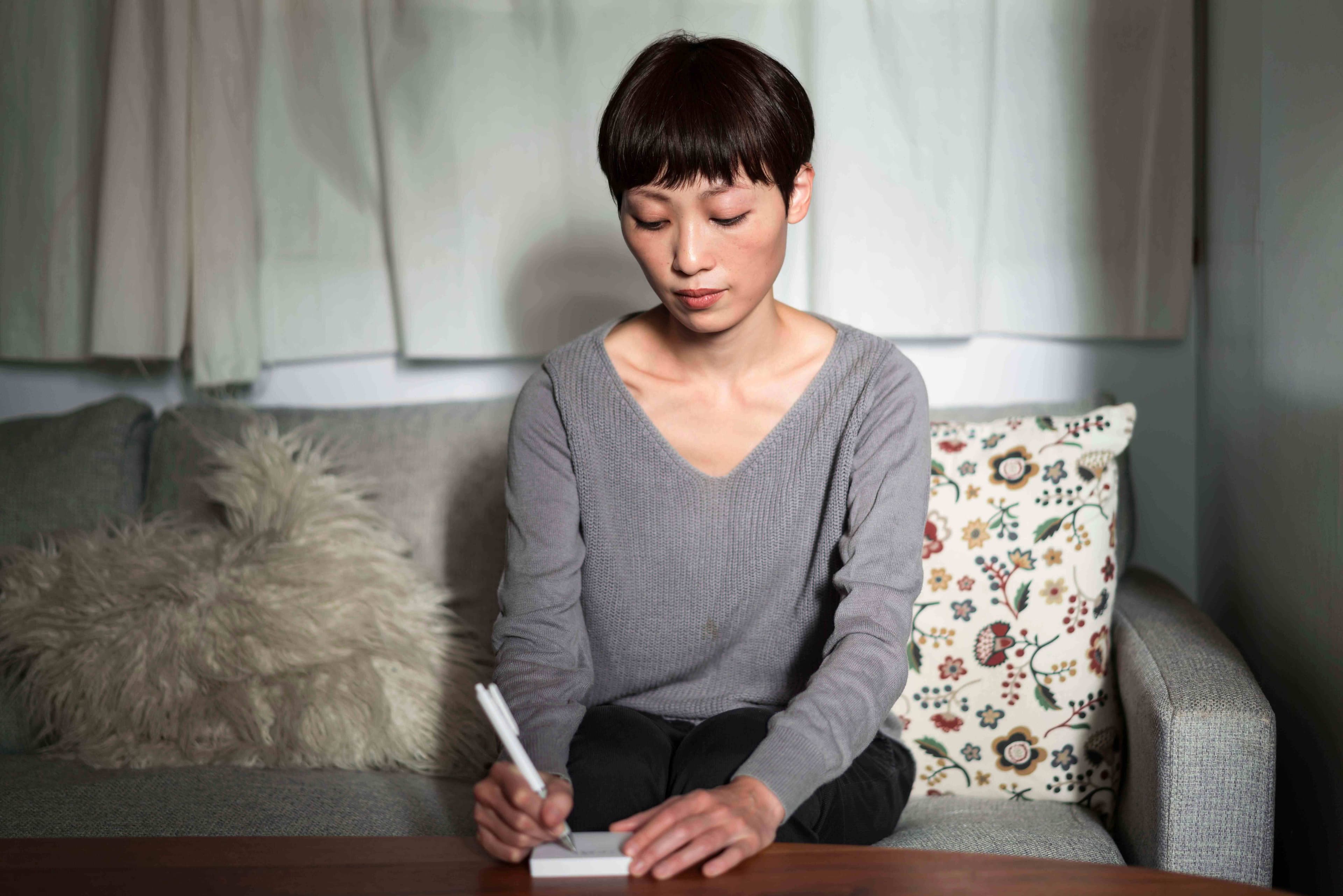 A person taking a depression test offline