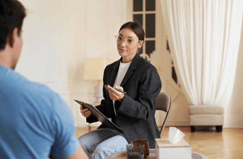 Therapist engaging the client during therapy for personal development.
