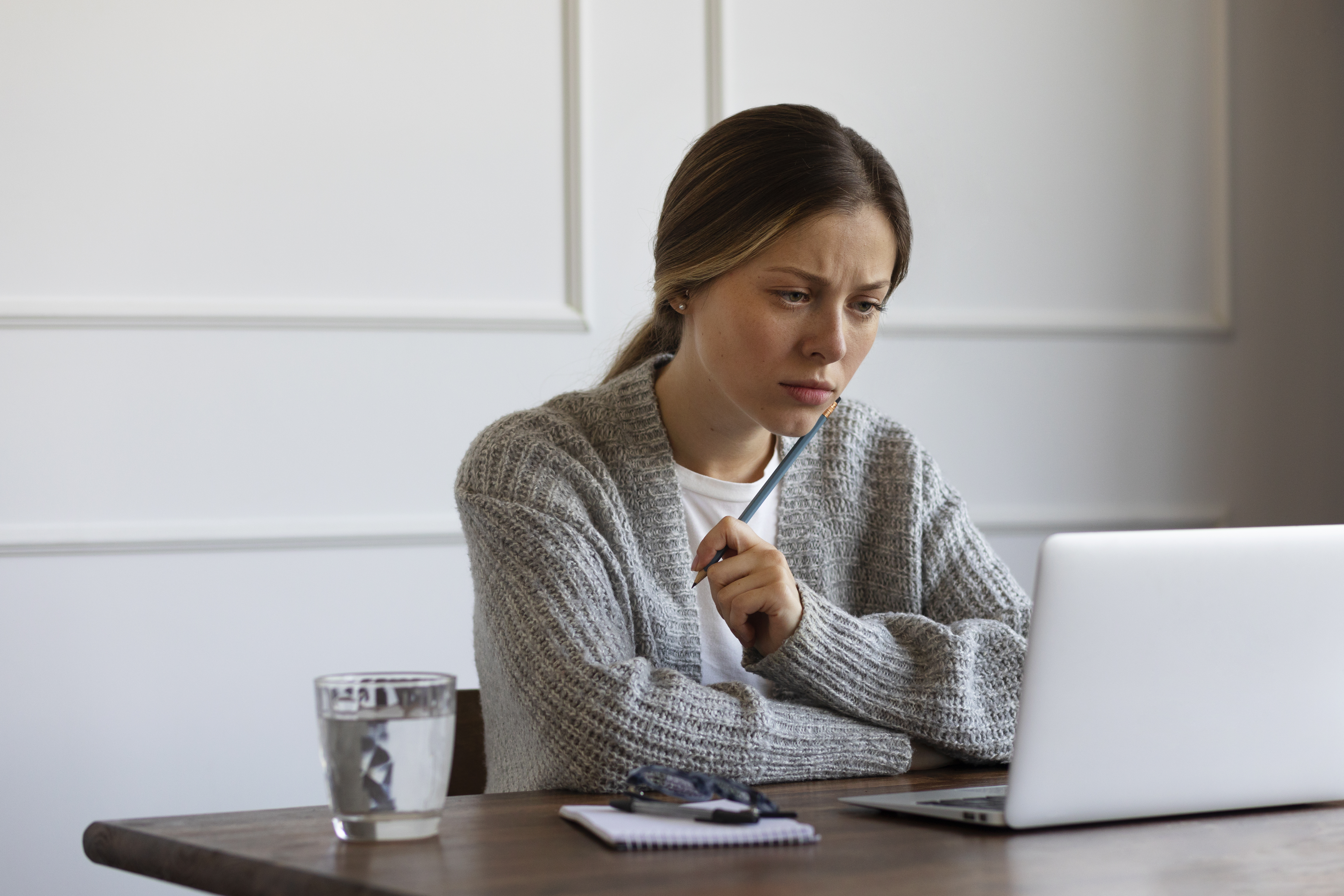 Woman with ADHD using a laptop.