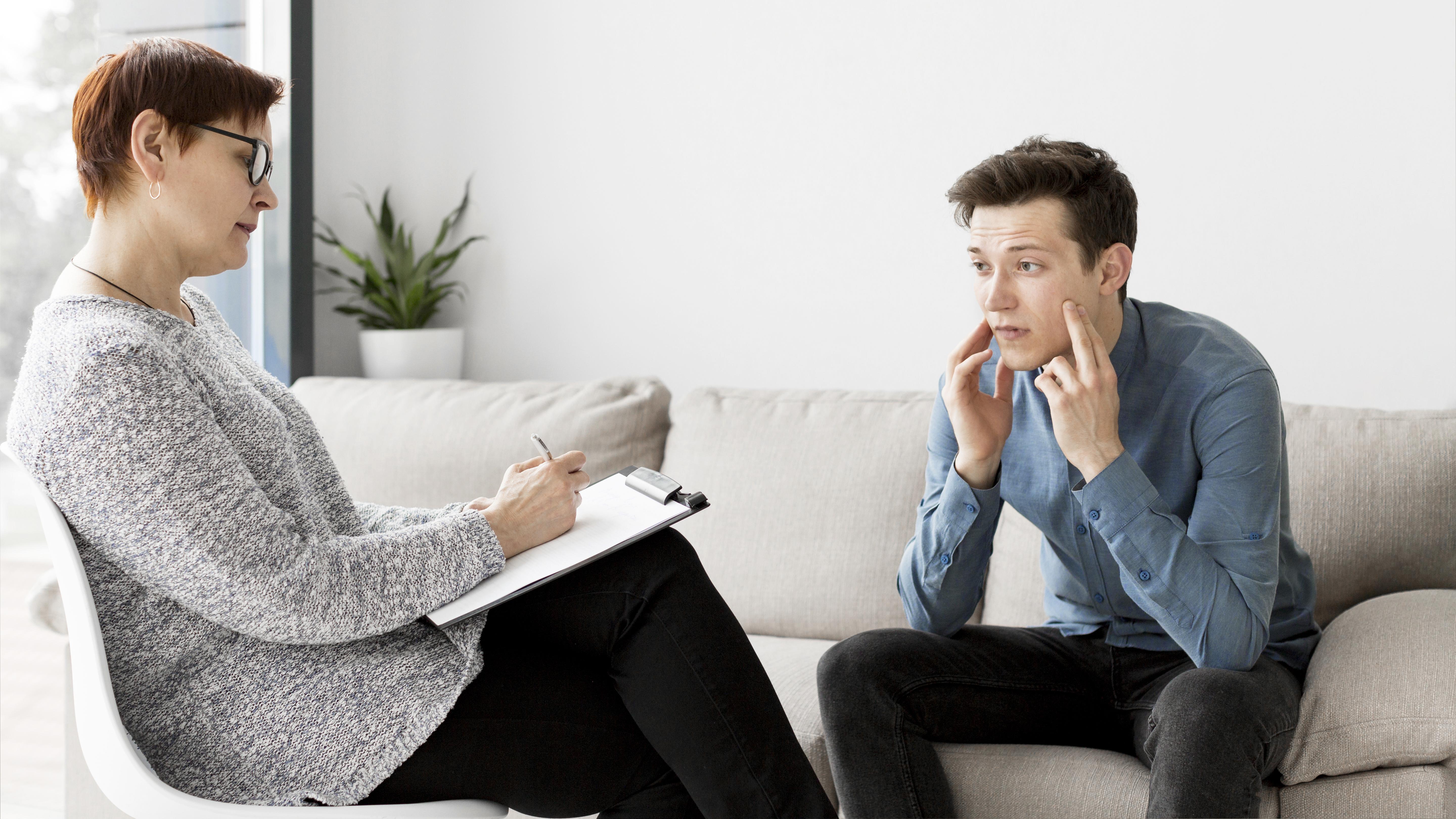 Counsellor taking a client assessment during depression counselling in Singapore