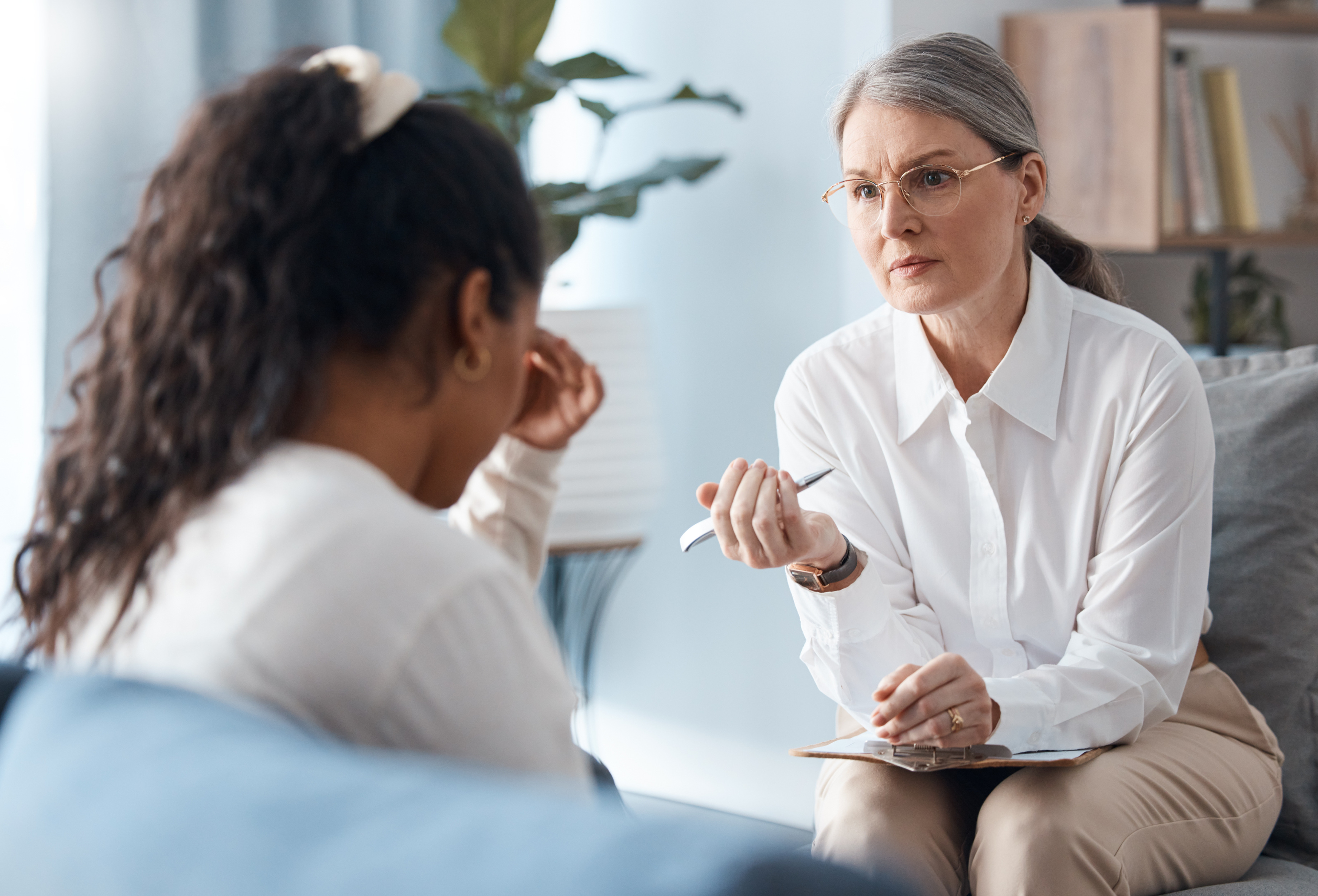 A therapist taking a depression test to diagnose a client