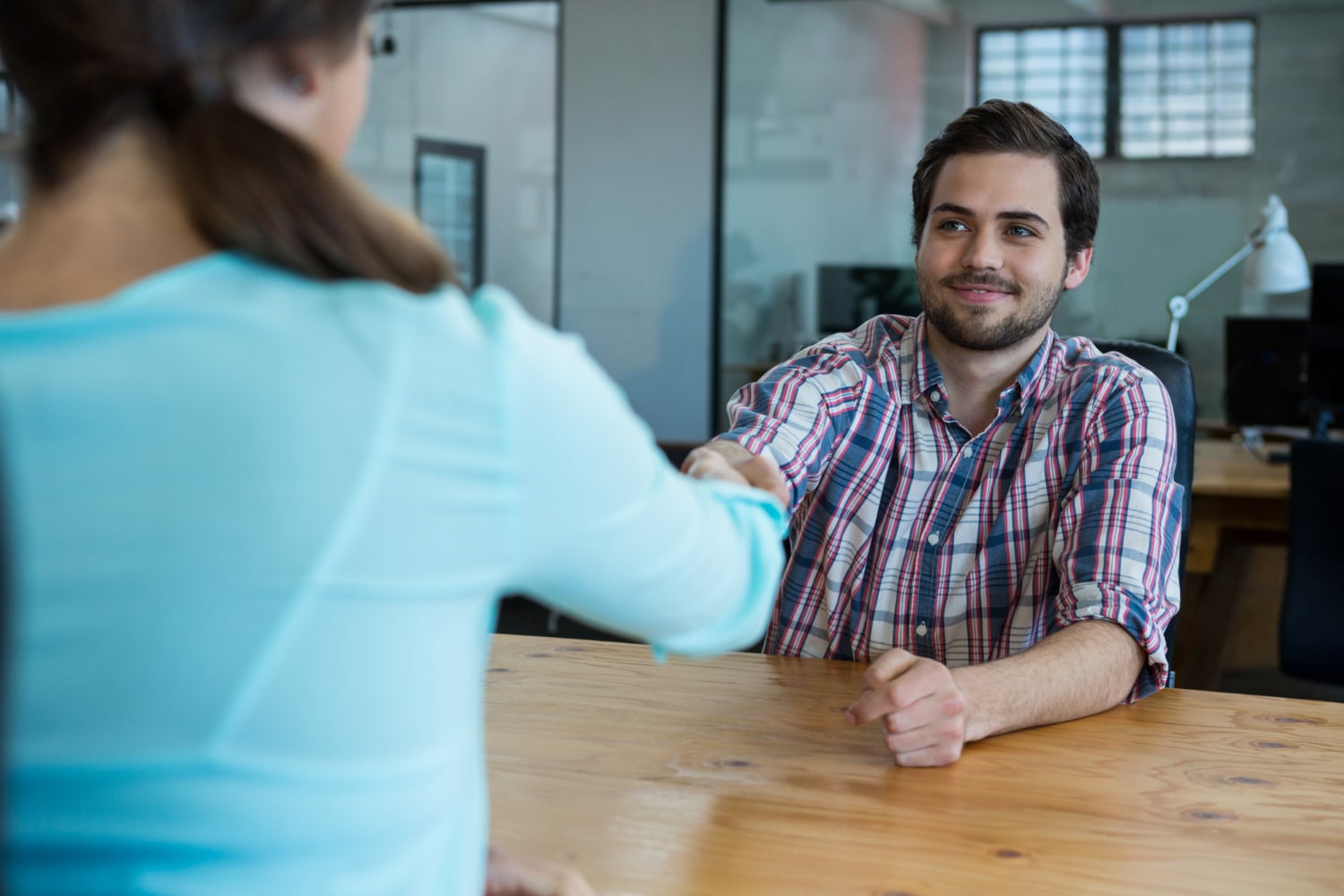 A therapist welcoming a client before talk therapy.