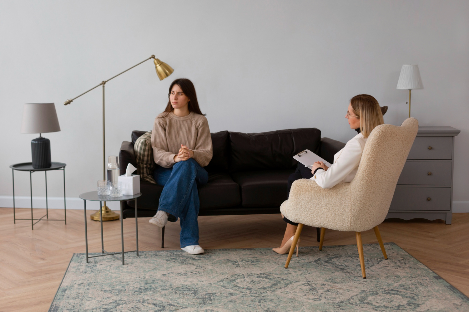 A counsellor and client talking during a counselling session.