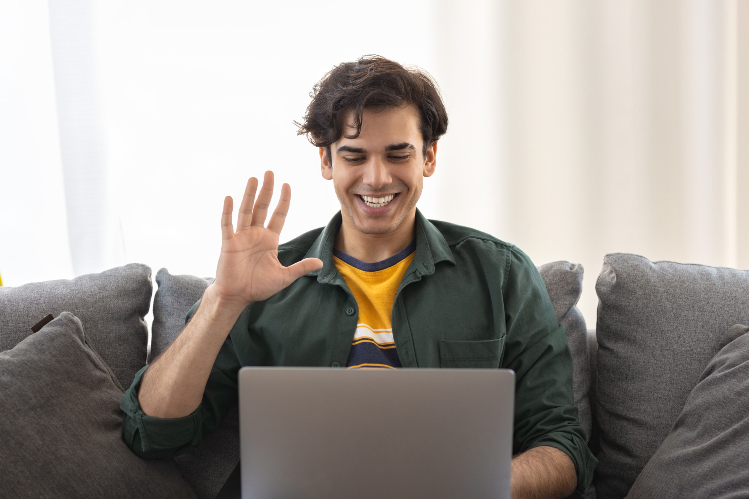 A person talking to an online therapist on video call.