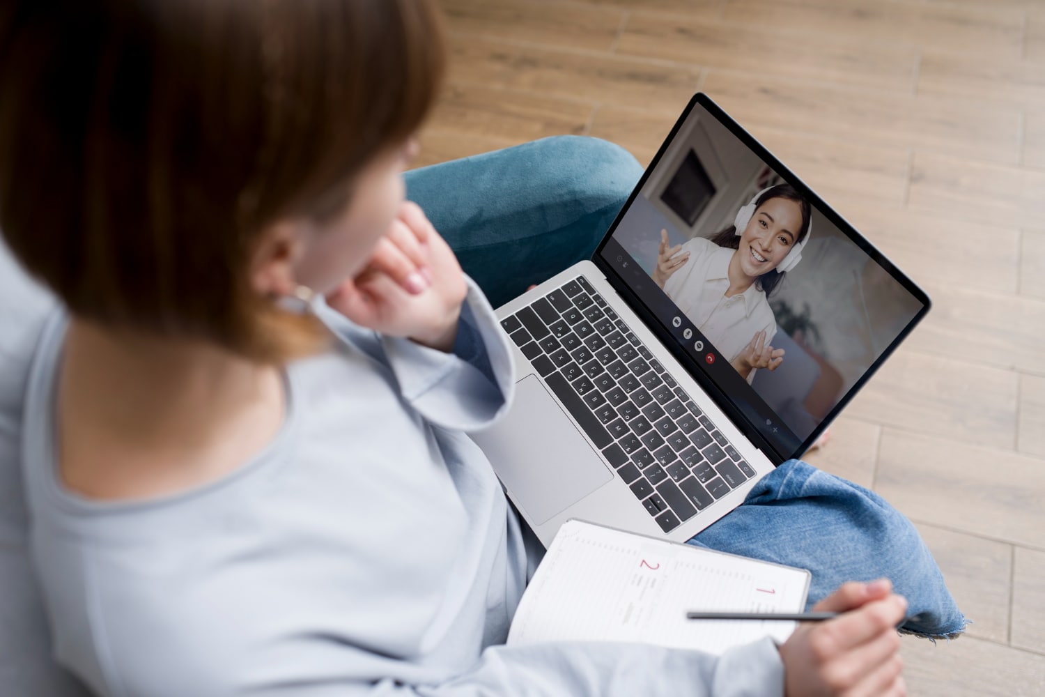 An online therapist providing support to a client through a video session.