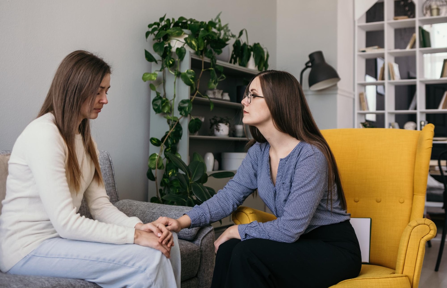 Therapist session with a compassionate conversation in a calming setting.