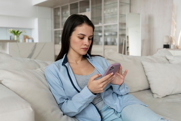 A person using a mental wellness app on their mobile phone.
