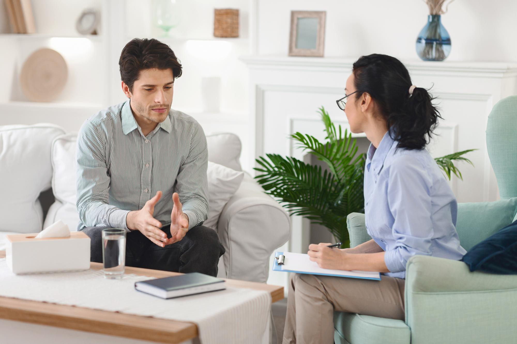 A client and Therapist in Singapore discussing their goals for therapy in the first session.