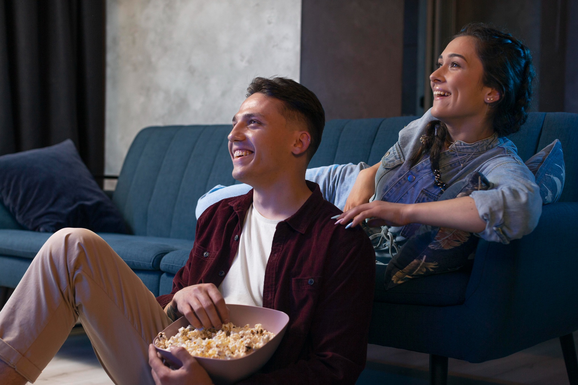Two friends watching a movie or TV show with a relatable mental health storyline.