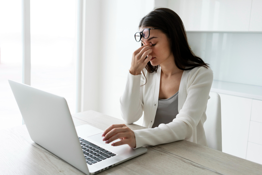 A woman feeling stressed and looking to book a therapy session.