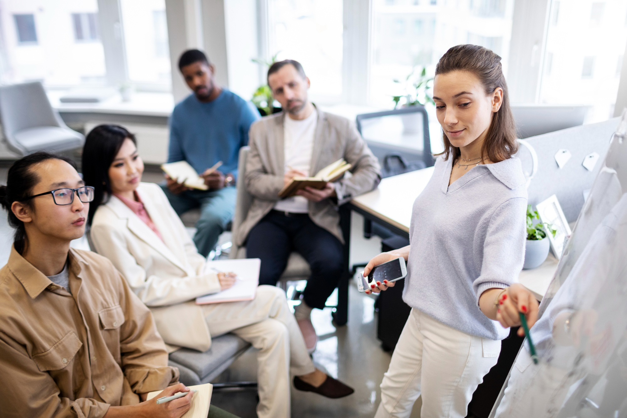 A corporate team engaged in a workshop through their company's Employee Assistance Program.