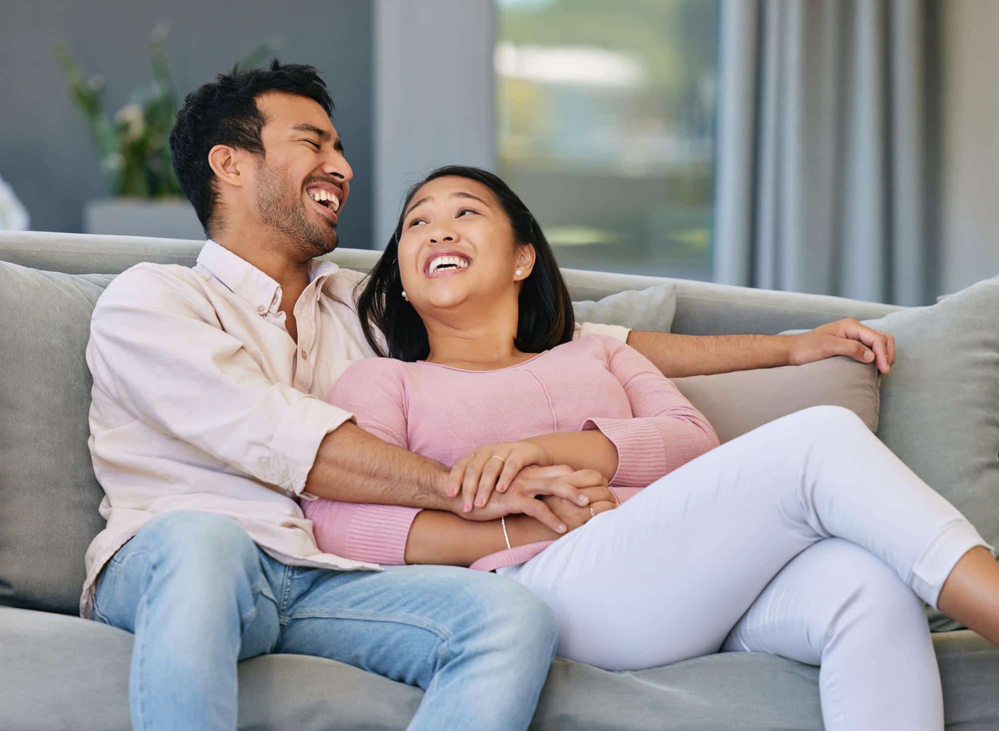 A Singaporean couple having a heartful conversation at home.